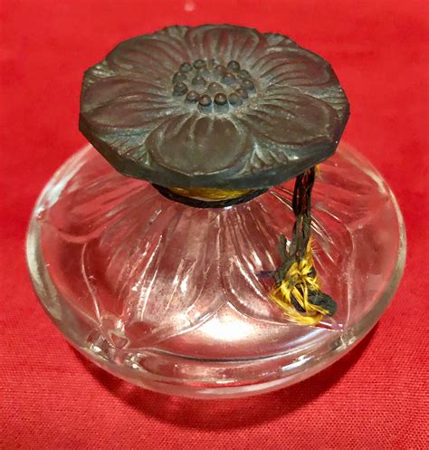 antique amber perfume bottle with flower design stopper